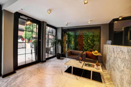 a living room with a couch and a table at The Capital Hotel in Istanbul