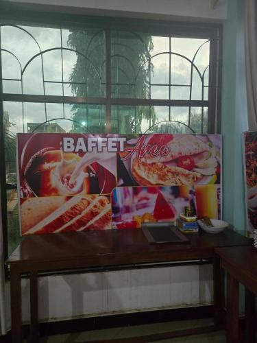 a table with a box of food on it at Tulivu Urban - Twiga Hotel in Moshi