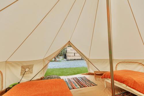 a tent with two beds in a room at Geometry Park in Ayios Theodhoros