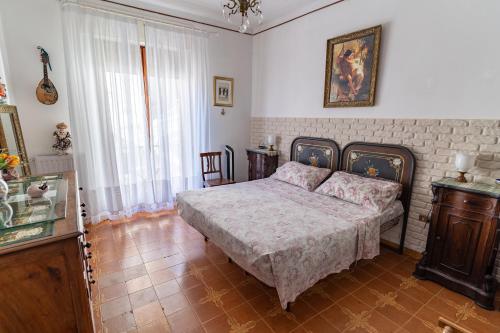 a bedroom with a bed in a room at CristallPont Amalfi Day in Atrani
