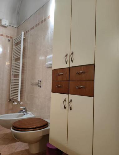 a bathroom with a toilet and a sink at Sweet home Lago di Garda in Prevalle