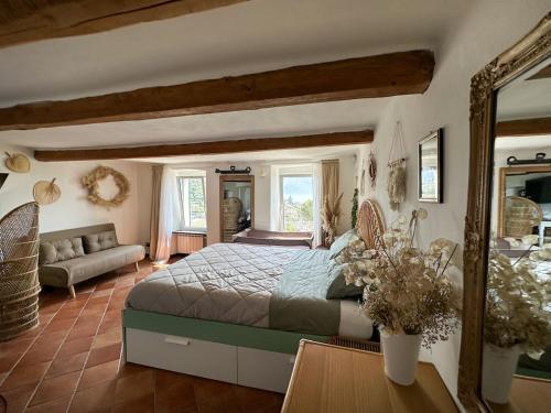 a bedroom with a bed and a living room at Golfo Paradiso Home in Sori