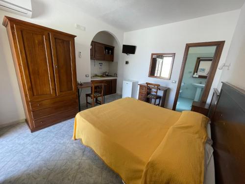 Postel nebo postele na pokoji v ubytování Residence Andrea a mare