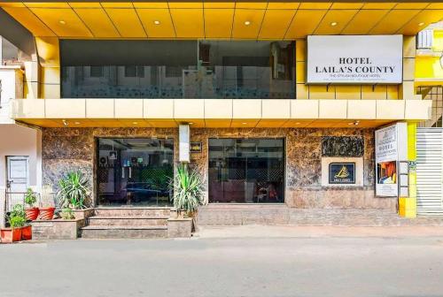a store front of a hotel with stairs in front at Lailas County Near by Rock Beach in Puducherry