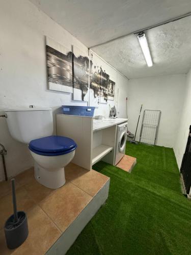 a bathroom with a toilet and a sink at Casa Oasis in Nerja