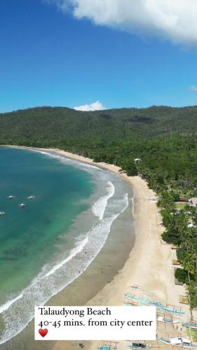 an aerial view of a beach with the ocean at Villa Skanderbeg Guest House in Puerto Princesa City