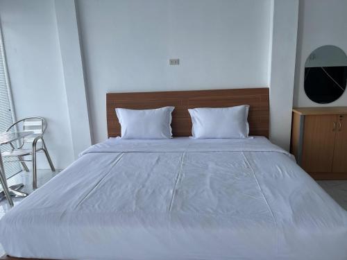 En eller flere senge i et værelse på Pantai Concesso Resort Haranggaol