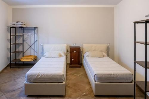 Ένα ή περισσότερα κρεβάτια σε δωμάτιο στο Casa Vacanze Matteo da Gualdo