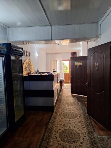a kitchen with a sink and a counter top at гостиница ЭРБИЛЬ in Taraz