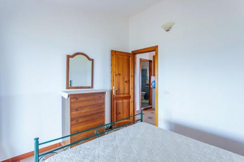 Postel nebo postele na pokoji v ubytování Comino Alto Agriturismo e Appartamenti