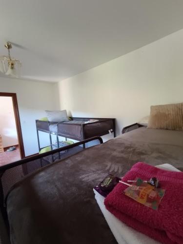 a bedroom with a bed with a red blanket at Casa Rural Chalet Venta del Aire Cortijo Terron in Lanjarón