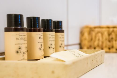 four bottles of essential oils in a wooden box at penzion Dvorce in Třeboň