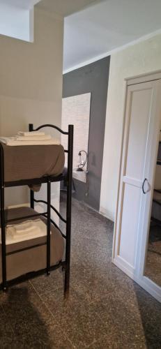 a room with a table and a room with a door at lalunanera in Cortazzone