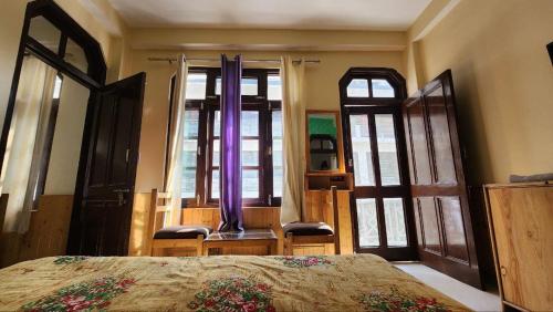 Letto o letti in una camera di Purple House