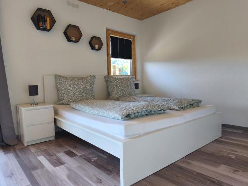 Postel nebo postele na pokoji v ubytování Ferienwohnung Bergzauber Schwarzwald