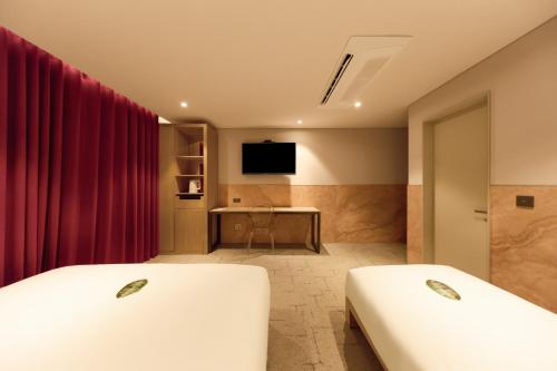 Postel nebo postele na pokoji v ubytování Capace Hotel Gangnam