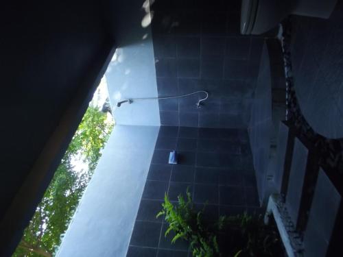 an overhead view of a tile floor with a lamp at Gili Flush Harmony in Gili Trawangan