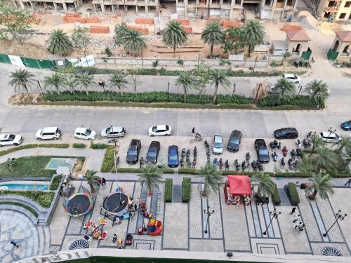 an aerial view of a parking lot with cars at Omaxe Hazratganj- Healing Staytion- Lucknow in Lucknow