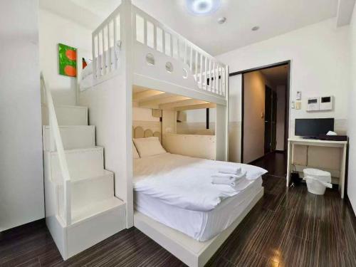 a bedroom with a white bunk bed and stairs at Rest collection Gion-Shijo Kyoto in Kyoto