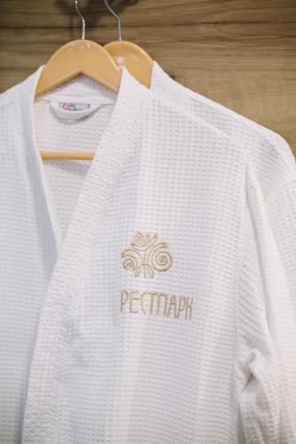 a white shirt is hanging on a hanger at Рестпарк рекреаційний комплекс in Luts'k