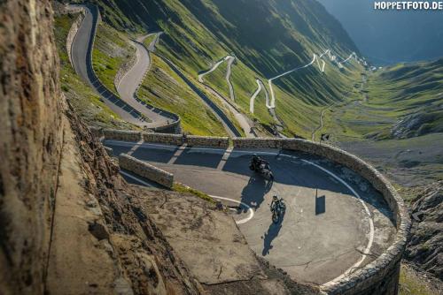 a group of people riding bikes on a mountain road at Landhotel Anna in Silandro
