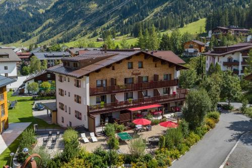 an aerial view of a hotel in the mountains at Hotel Appartement Roggal in Lech am Arlberg