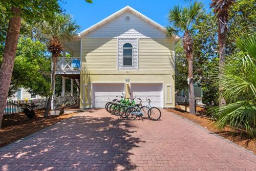 a house with two bikes parked in front of it at Brzee Bungalow in Destin