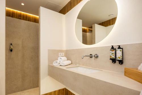 a bathroom with a sink and a mirror at Aristoy in Tarifa