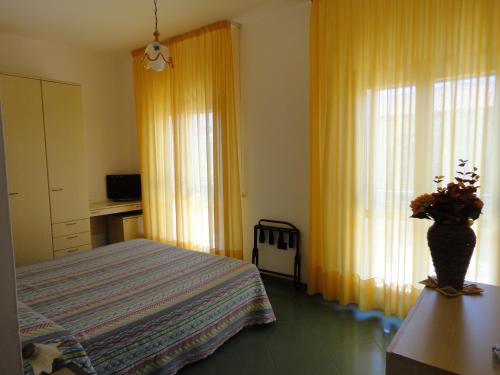 Кровать или кровати в номере Hotel Silvestrino