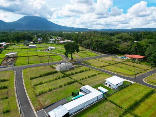 an aerial view of a farm with a road at Casa Cristal # 1 in Fortuna