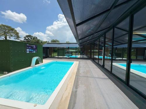 an external view of a building with a swimming pool at Casa Cristal # 1 in Fortuna