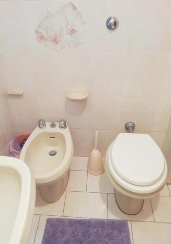 a bathroom with a toilet and a bidet and a sink at La Terrazza in Barano d'Ischia