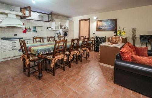 a kitchen with a table and chairs in a room at La Taverna dell'Oasi in Manoppello