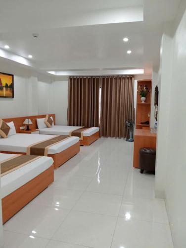 Postel nebo postele na pokoji v ubytování Sail Hotel Hạ Long