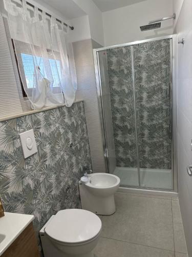 a bathroom with a toilet and a shower at B&B Casa Lulu' in Peschici