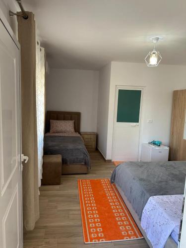 Ein Bett oder Betten in einem Zimmer der Unterkunft Vila Zefi
