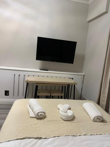 Letto o letti in una camera di Devonshire Terrace Studios