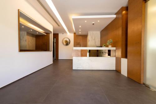 an empty hallway with a kitchen in a building at Mateus Hotel & Pool in Jounieh