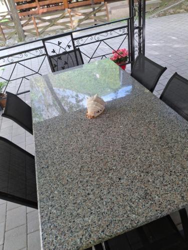a table with a toy animal sitting on top of it at Moravski konak- Moravian Inn in Ovčar Banja