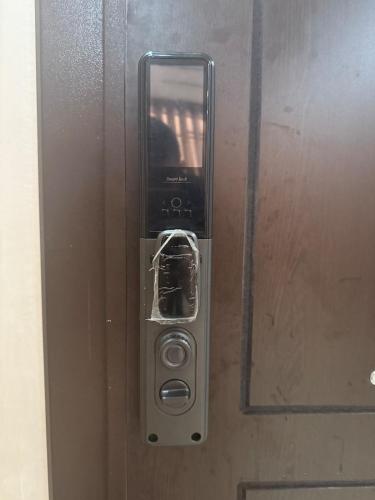 a door with a cell phone inside of it at Comfortable and quiet apartment with Buzzinga in Bouznika