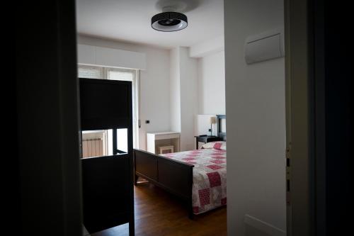 a bedroom with a bed and a mirror in a room at B&B Agrimare SAN SALVO MARINA in Marina di Montenero