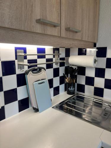 a kitchen with a cell phone on the counter at Ferienwohnung am Labyrinth in Semriach