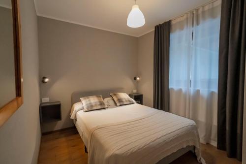 Postel nebo postele na pokoji v ubytování Condhotel Fanti