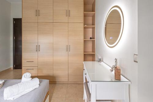 a bathroom with a sink and a mirror at Xenia Serenity in Kalamata