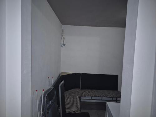 a small room with a chair and a table at Luxury Apartments Central KIRIL I METODII 3 in Burgas City
