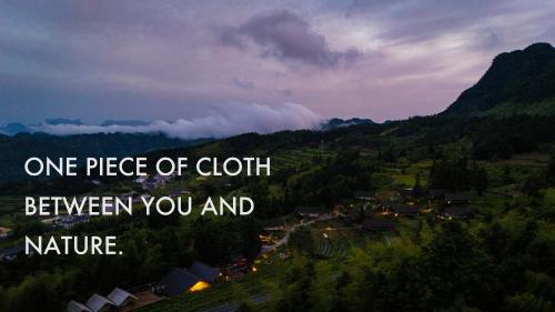 a view of a town in a valley withone piece of cloth between you at BZIKA Wonderland Retreat--Zhangjiajie National Forest Park Store in Zhangjiajie