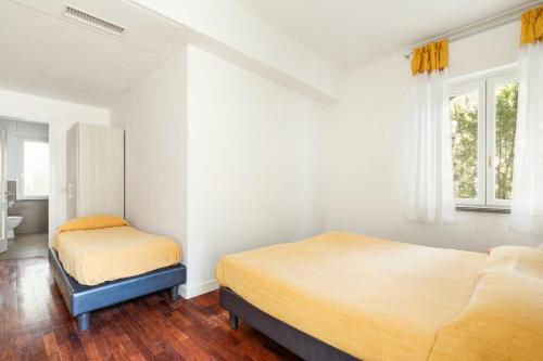 Ένα ή περισσότερα κρεβάτια σε δωμάτιο στο YourHome - Villa Sorrento