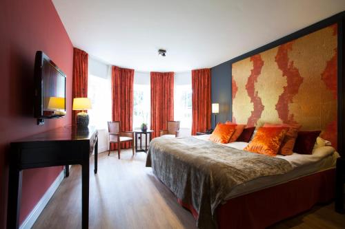 Ένα ή περισσότερα κρεβάτια σε δωμάτιο στο Hotel Bloemendal, near Aachen