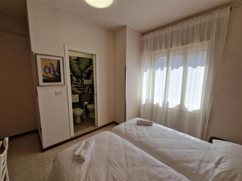 Ένα ή περισσότερα κρεβάτια σε δωμάτιο στο Albergo D'Ambros - Casa Belfiore Group