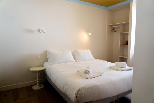Postel nebo postele na pokoji v ubytování Hotel Bleu Soleil